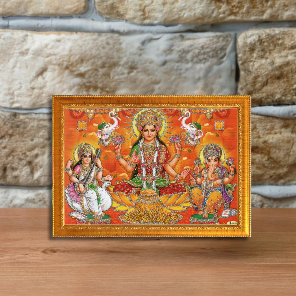 CRAFT QUEST Lakshmi Devi with ganesh ji and saraswati maa Wall Painting Frame Home Decor (Synthetic, Sparkle Finish, Large Size, Golden, 8 X 6 Inch)